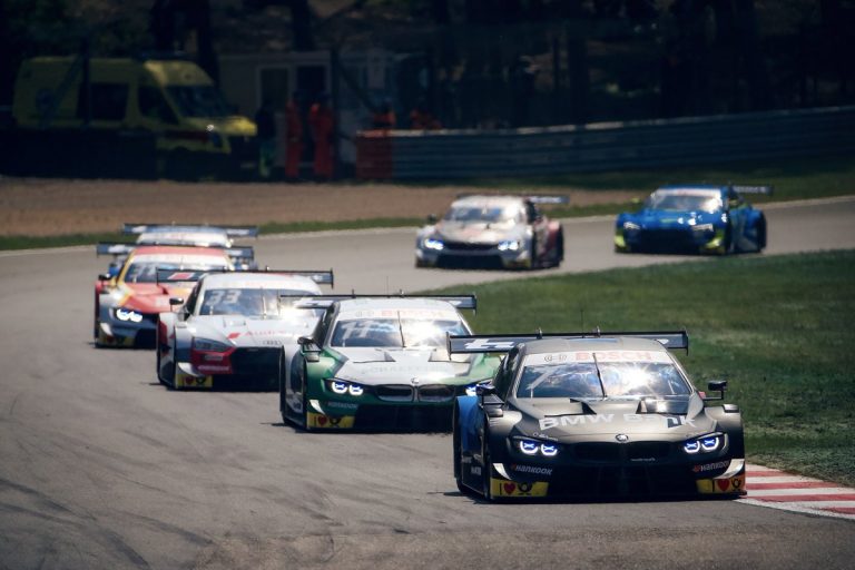 Drošības mašīnas fāzes palīdz Engam un Rastam izcīnīt uzvaras DTM sacīkstēs Beļģijā